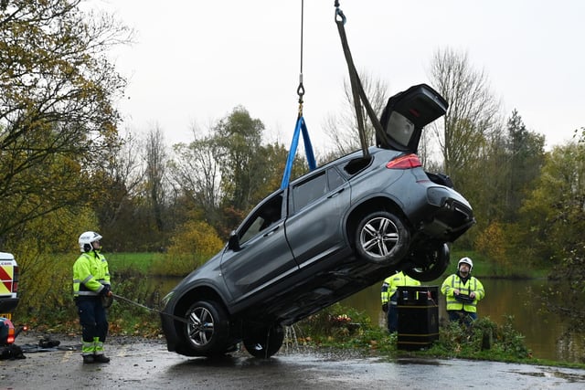 The car was winched from the water to land and the gathered crowd gave a round of applause.