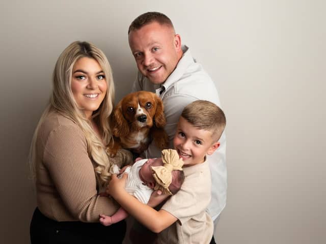 Sophie and Reece with their children and their dog Chester