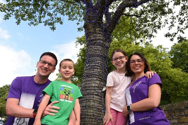 James and Lois Rowland at Wigan Infirmary's Tree of Hope with their children Benjamin, six, and Molly, nine