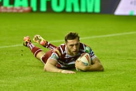 Jake Wardle scored a length-of-the-field try for Wigan's first points against Huddersfield Giants