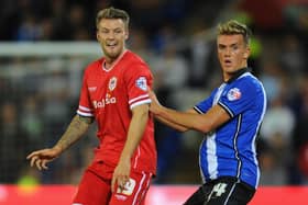 Emyr Huws, who went on to sign for Cardiff, does battle with future Latics player Anthony Pilkington