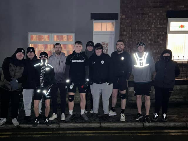 Ewan Topping, centre, is inviting men to join him as he runs 5km each day until Christmas Day to support Andy's Man Club