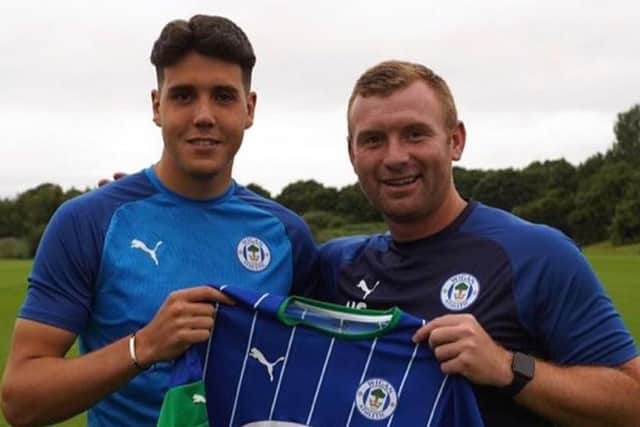 Jack Sanders with his Latics Academy coach Nick Chadwick