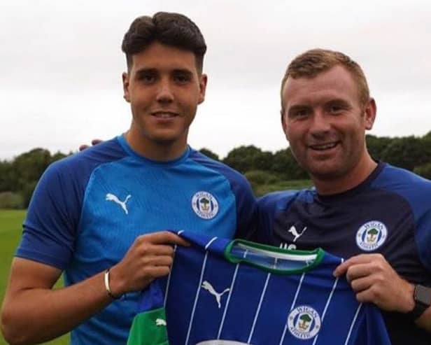 Jack Sanders with his Latics Academy coach Nick Chadwick