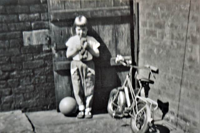 Gail as a child with her bike, her teddy, and her football