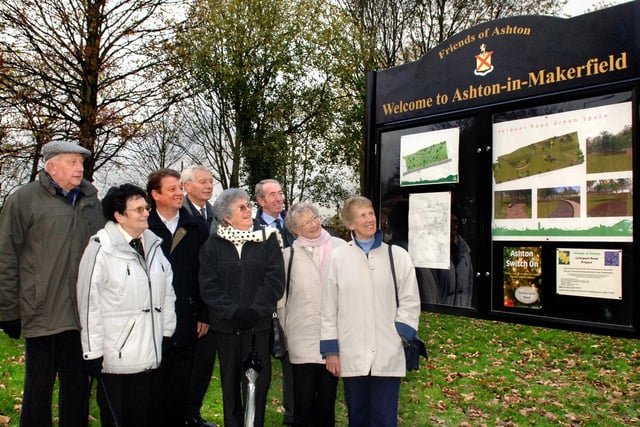 The Friends of Ashton in a section of the transformed land on Liverpool Road where a Welcome board has been errected with details of the project. Left to right, Coun. Walter Carney, Betty Carney, Coun. Paul Tusshingham, Coun. Don Hodgkinson, Ethel Glover,  Ernie Moores, Pat Grimshaw and Doreen Glover. 