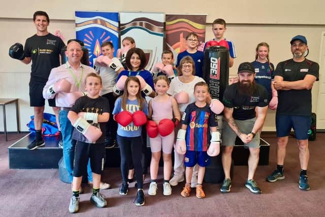 Boxing for Better CIC celebrate receiving their new equipment