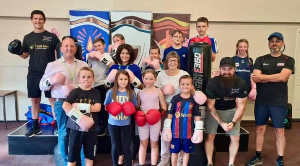 Boxing for Better CIC celebrate receiving their new equipment