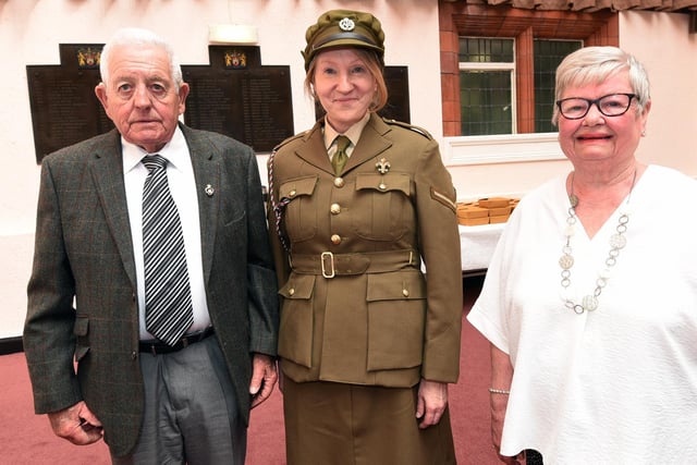 Deborah Pugh, centre, from 5th Bn. Manchester Regiment Living History Museum, with veteran Thomas Haselden and wife Elaine, right.