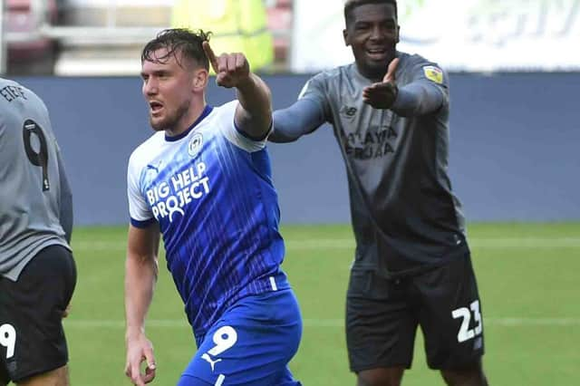 Charlie Wyke celebrates his goal for Latics against Cardiff