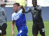 Charlie Wyke celebrates his goal for Latics against Cardiff