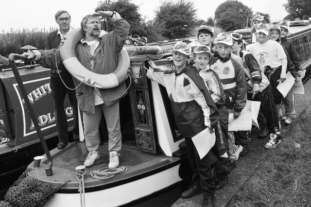 Goodies comedy actor, Bill Oddie, with pupils of St. Wilfrid's Junior School as he launched the "Waterline Day of Action" on the canal at Red Rock in April 1992.
The project was a canalside wildlife and plant survey.
