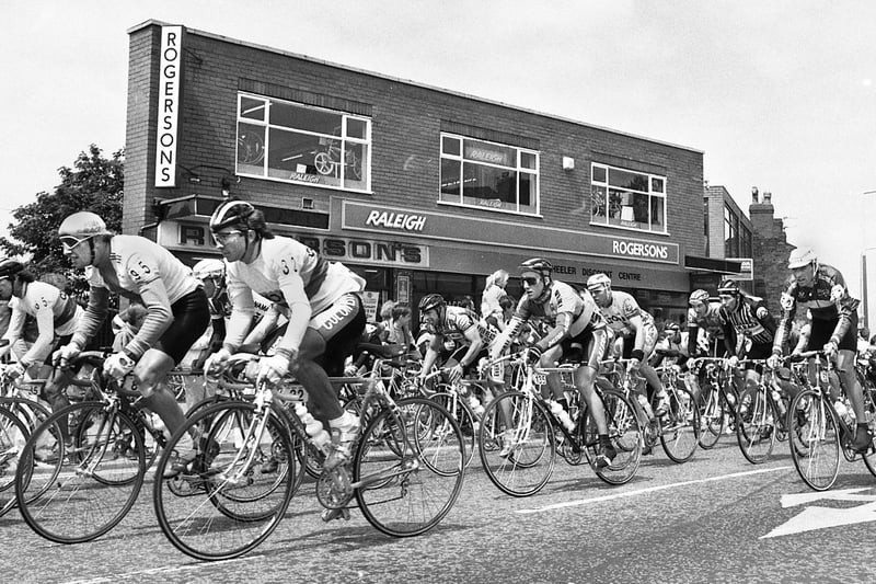 The Tour of Britain Milk Race passes Rogersons bike shop at Orrell Post on a stage of the top cycling event on Sunday 3rd of June 1989.