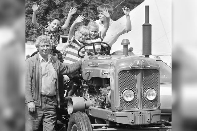 Youngsters enjoy one of the tractor exhibits at Haigh, Aspull and Blackrod Agricultural Society Show on Sunday 16th of August 1992.