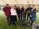 The Mayor of Wigan Coun Marie Morgan and Melanie Bryan DL, right, joined by members of The Bridgers - Howe Bridge community group,  at the tree-planting ceremony, with a rowan tree, one which formed the tree-of trees outside Buckingham Palace, part of the 21-metre-high sculpture was designed to draw attention to the Queen's Green Canopy tree-planting campaign for the Queen's Platinum Jubliee.  Planted at Colliers Corner, Howe Bridge.