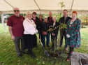 The Mayor of Wigan Coun Marie Morgan and Melanie Bryan DL, right, joined by members of The Bridgers - Howe Bridge community group,  at the tree-planting ceremony, with a rowan tree, one which formed the tree-of trees outside Buckingham Palace, part of the 21-metre-high sculpture was designed to draw attention to the Queen's Green Canopy tree-planting campaign for the Queen's Platinum Jubliee.  Planted at Colliers Corner, Howe Bridge.