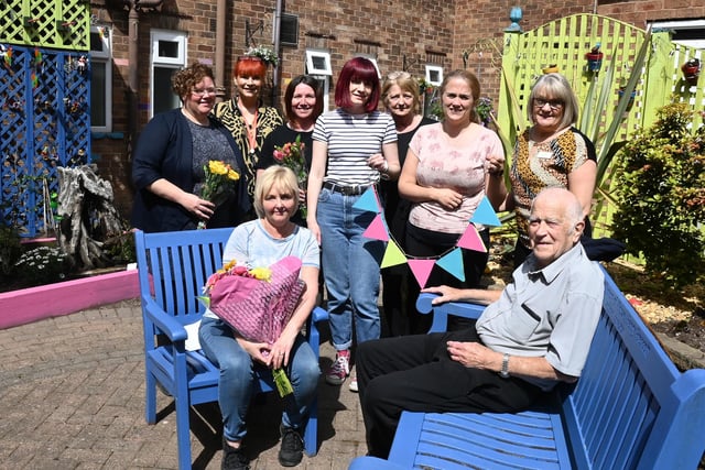 Residents, staff and school staff involved in the project enjoying the outdoor space.