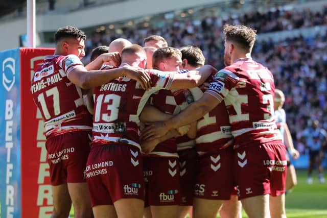 Wigan Warriors celebrate the opening try