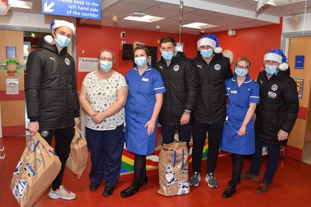 Thelo Aasgaard, Callum Lang, Thelo Aasgaard and Mal Brannigan meet some of the staff