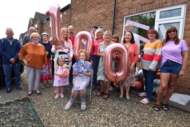 Wiganer Gladys Guest celebrates her 100th birthday, with a telegram from the Queen, surrounded by family and friends.