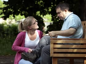 A person with autism and his carer
