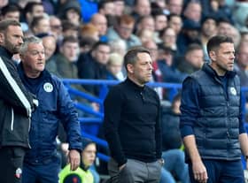 Ian Evatt watches on with the Latics bench during Bolton's 4-0 defeat in October