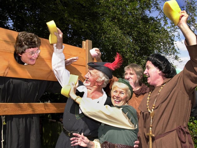 Curate, Rev. Judith Ball, was collared in the stocks during the Medieval Fair at St. Thomas the Martyr Church, Upholland, on Saturday 13th of July 2002.