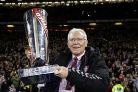 Departing Wigan chairman Ian Lenagan with the Betfred Super League tropy after his side's victory over Catalans at Old Trafford