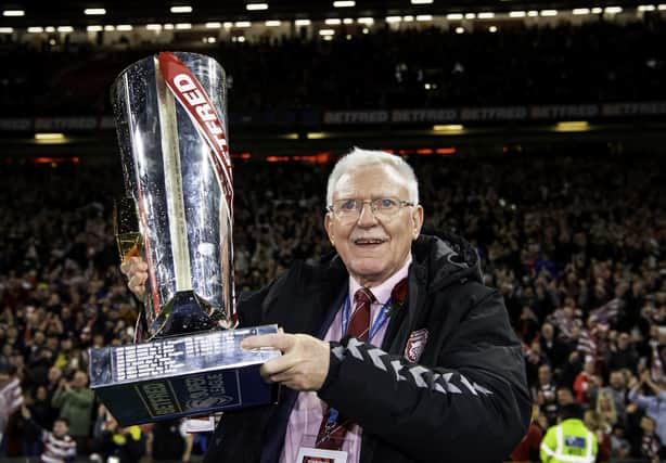 Departing Wigan chairman Ian Lenagan with the Betfred Super League tropy after his side's victory over Catalans at Old Trafford
