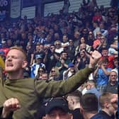 The Latics fans celebrate victory at Shrewsbury