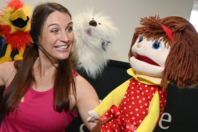 Lisa Lundie of Next STAGE Performing Arts with some of her puppets.