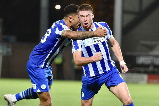 Latics went down to defeat at Burton despite holding a half-time lead thanks to Charlie Hughes
