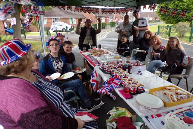 Residents of Langley Close, Golborne, defied the uncertain weather conditions on Sunday to hold their street party.
Councillors Yvonne Klieve and Gena Merrett dropped by for a bite and some banter with the residents, their family, and friends.