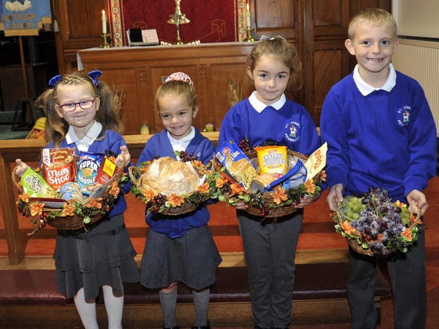 Myah Simpkin, five, Nevaeh Pointer, five, Isabella Edwards, six and Samuel Bartley, nine from St John's Primary School at the Pemberton St John's Church Harvest Festival