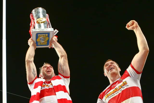 Wigan's Pat Richards and Scott Taylor celebrate with the Super League trophy in 2013 at Old Trafford