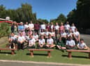 The year six class in the Peace Garden after receiving their badges