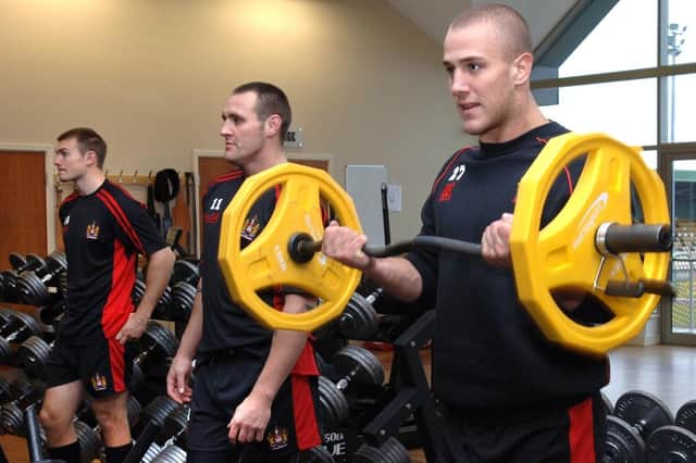 Liam Colbon, Gareth Hock and Lee Mossop in the gym as Wigan Warriors resume training.