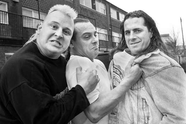 American wrestling superstars the Nasty Boys, Brian Nobbs, left, and World Heavy Weight Champion Brett "Hitman" Hart, right, get to grips with the original British Bulldog, Tommy Billington, outside his house in Douglas Way, Platt Bridge, on Monday 1st of February 1993.
The Nasty Boys were in Manchester for the start of their World Wrestling Federation promotional tour and stopped off in Platt Bridge to meet up again with their battling British buddy and former champion Tommy who was part of the British Bulldog tag team along with his cousin, Golborne man, Davey Boy Smith, who was a wrestling megastar in the States.