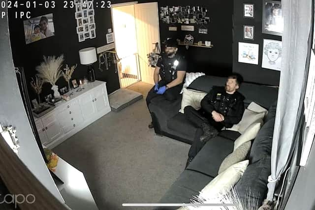 Officers watching television in Abbygail Lawton's home