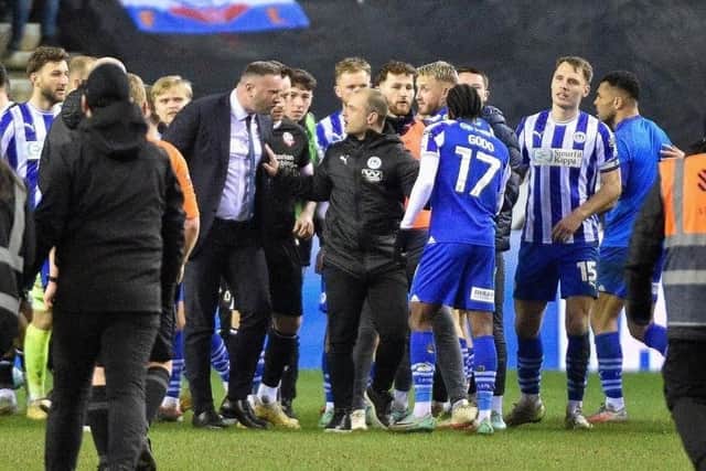 Shaun Maloney has to intervene as Martial Godo gets up close and personal with Bolton boss Ian Evatt last season