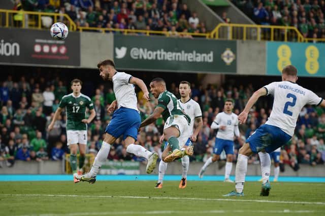 Josh Magennis stoops to head home Northern Ireland's winning goal against Kosovo