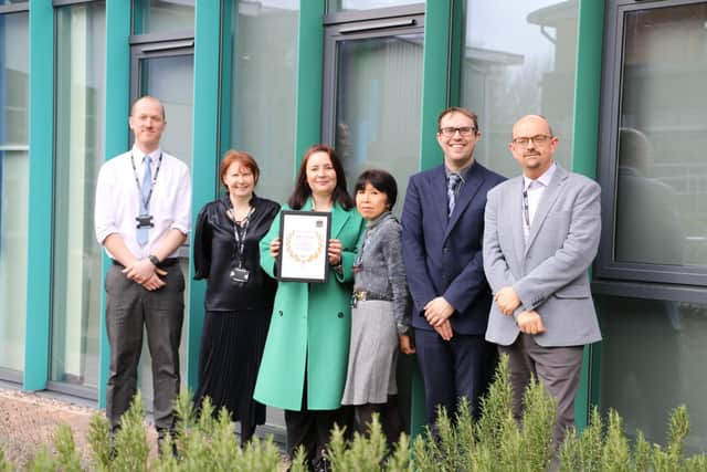 Head of Maths, Katie Williams (centre) with PTI Award