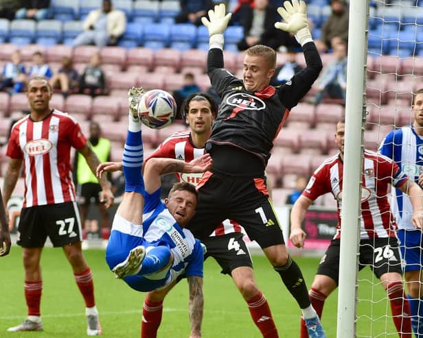 Substitute Dale Taylor tries to force a Latics winner in the second half