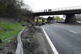 Dramatic photographs show the aftermath of a horror motorway crash which has left a lorry split in half.