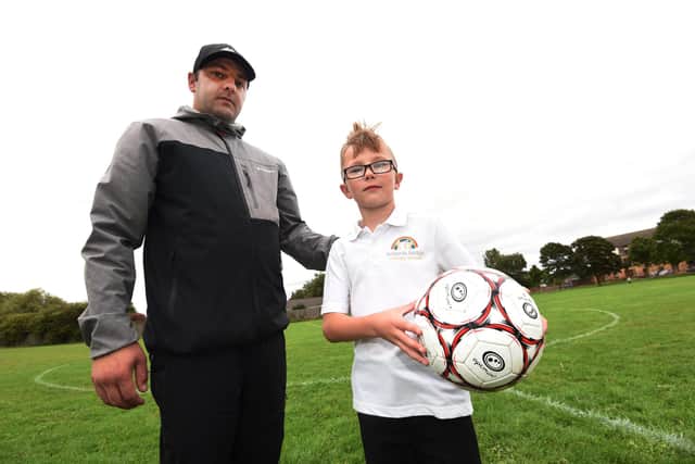 Michael Rasburn with son Arvie-Ray, eight, who plays for one of the Platt Bridge FC teams