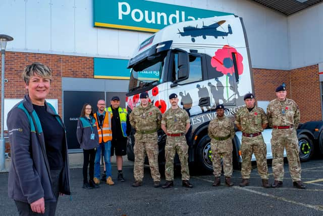 Poundland store manager Georgie Pugh, deputy Denise Gilligan, transport shift manager Darren Pye and driver Ian Marsh join soldiers from 32 Engineers and 5 Royal Artillery with one of three Poundland trucks wrapped for Remembrance Day outside the store in Catterick.