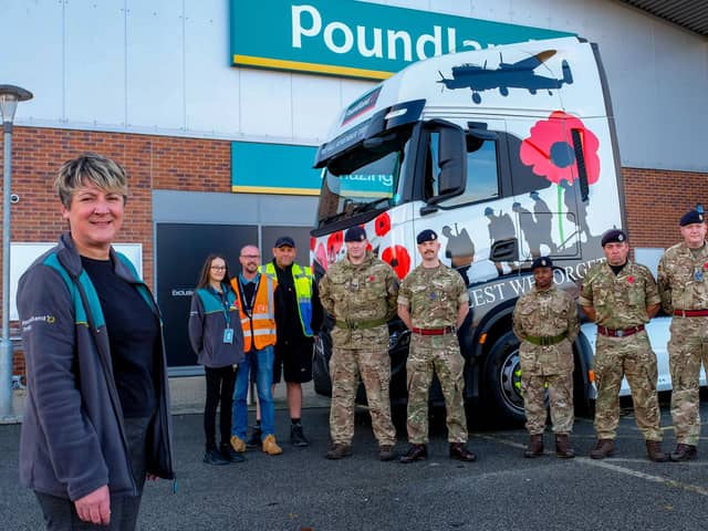 Poundland store manager Georgie Pugh, deputy Denise Gilligan, transport shift manager Darren Pye and driver Ian Marsh join soldiers from 32 Engineers and 5 Royal Artillery with one of three Poundland trucks wrapped for Remembrance Day outside the store in Catterick.