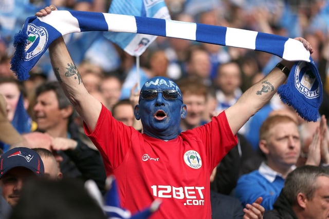 A Wigan Athletic fan shows his support in the stands during the FA Cup Final at Wembley Stadium, London. PRESS ASSOCIATION