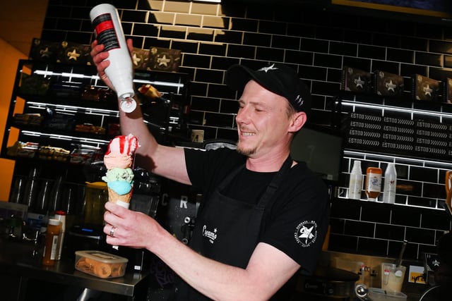 Michael Finch prepares an ice cream