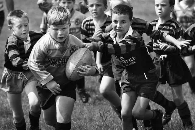 Three try hero 7 year old Danny Nanyn in action in the final against Leigh East.